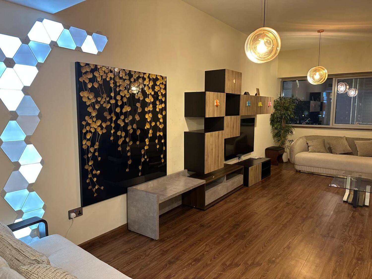 Table top glass jar of plants.